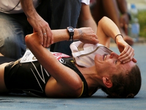 mary_davies_of_new_zealand_reacts_after_finishing_in_the_women_s_marathon_N2